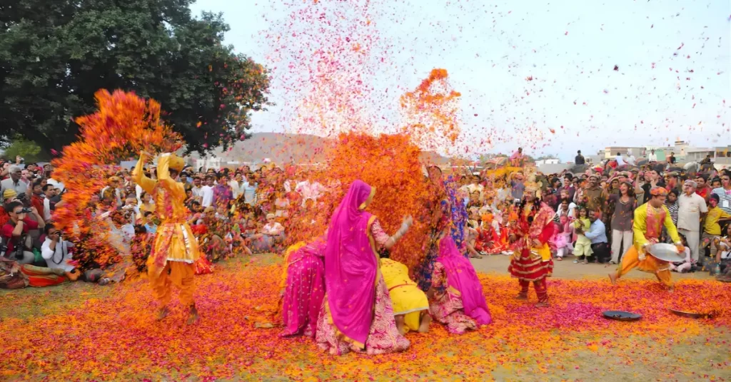 Men and women playing flower holi ; Jaipur ; Rajasthan ; India - Holi 2026 in Rajasthan