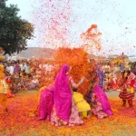 Men and women playing flower holi ; Jaipur ; Rajasthan ; India - Holi 2026 in Rajasthan
