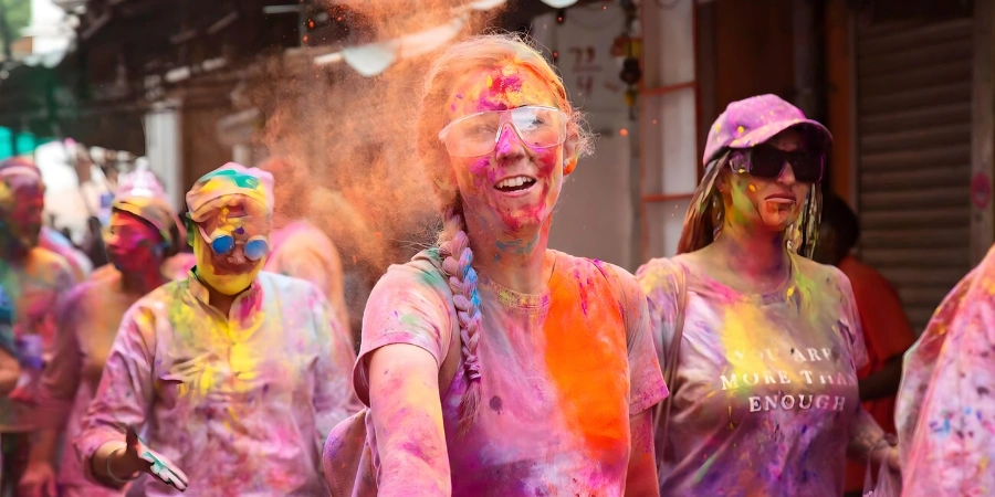 Holi celebration in Pushkar in Rajasthan, India, 4th of March 2026: People celebrating Holi festival throwing colors and dancing on the street